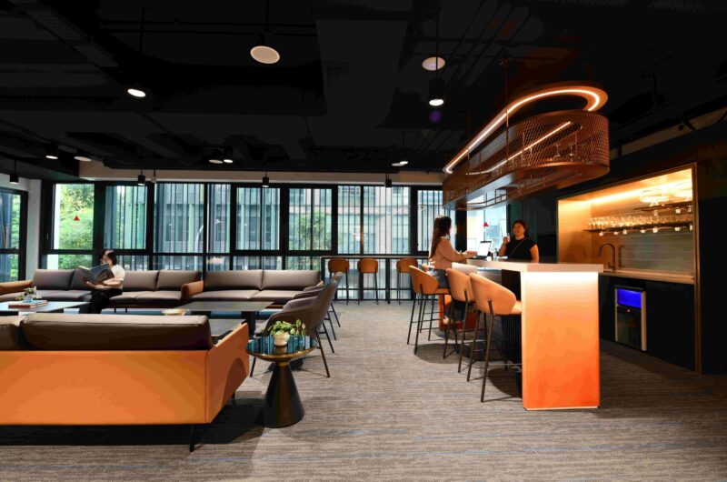 Orange theme office with grey carpet